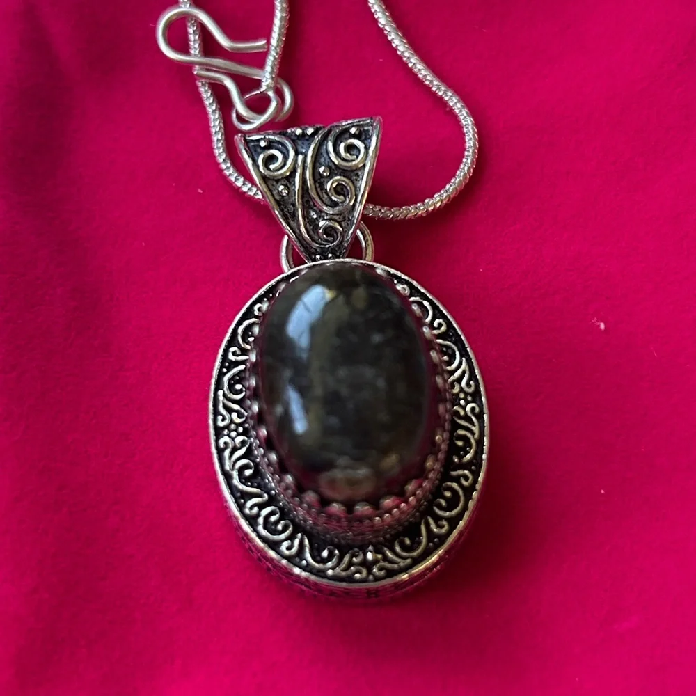 Vintage‎ dark brown black agate pendant with a sterling silver setting.